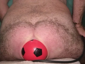 World record 13 cm wide anal stretching with inflatable ball.